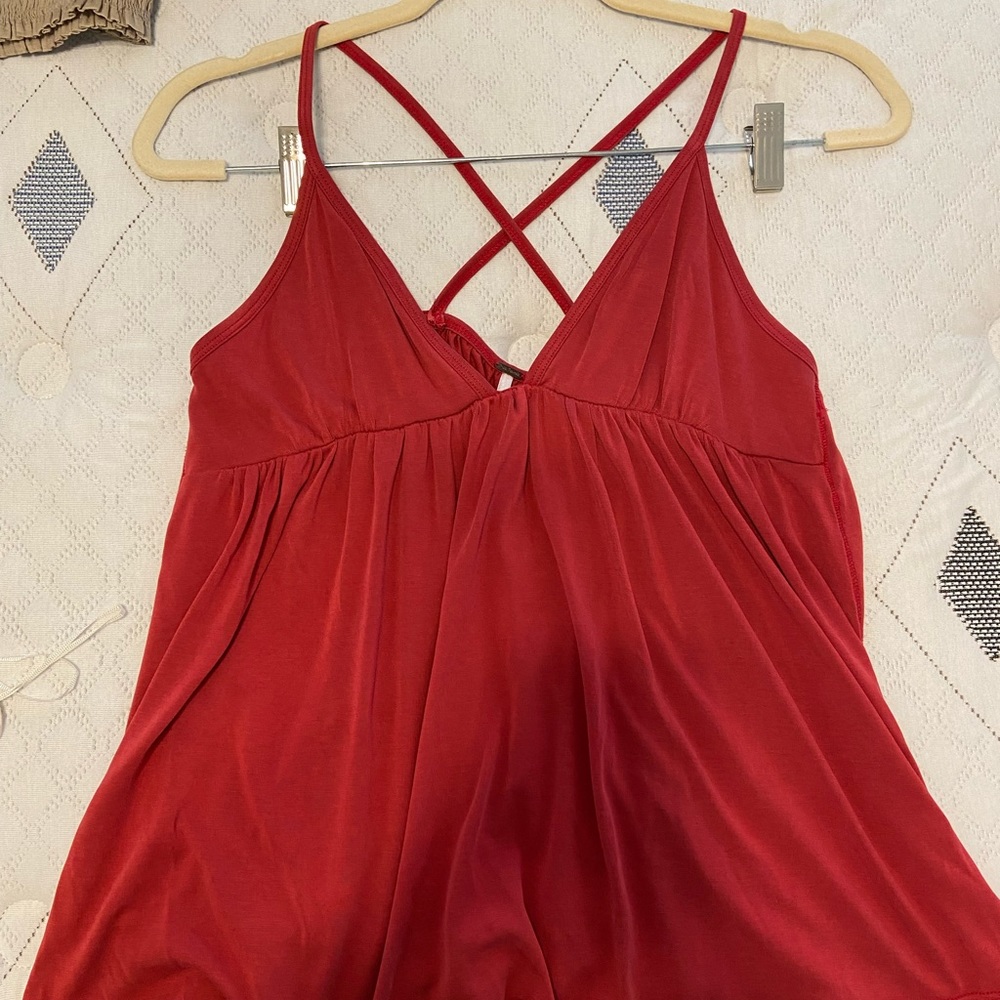 Red free people flow tank. Cris cross straps in back